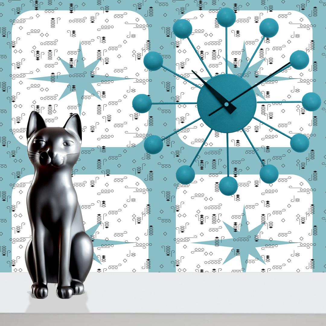 The artwork features a repeating geometric pattern of symmetrical shapes resembling elongated, curved diamonds or petals in various shades of blue and green. Each shape is split vertically with one half filled with a light blue and the other half filled with green or darker blue. The background is a light, almost pastel blue, which provides a soft yet vibrant backdrop. One of the blue shapes near the upper left contains a white starburst element, adding a focal point of brightness to the composition. The overall design conveys a modern, mid-century aesthetic with clean lines and harmonious color contrasts.